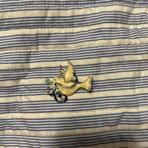 Fake diamonds dove bird holding a flower